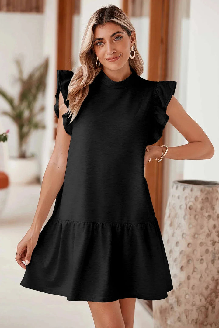 Black mini dress with ruffle detail sleeves, made of soft cotton blend fabric. Feminine and elegant design perfect for any…