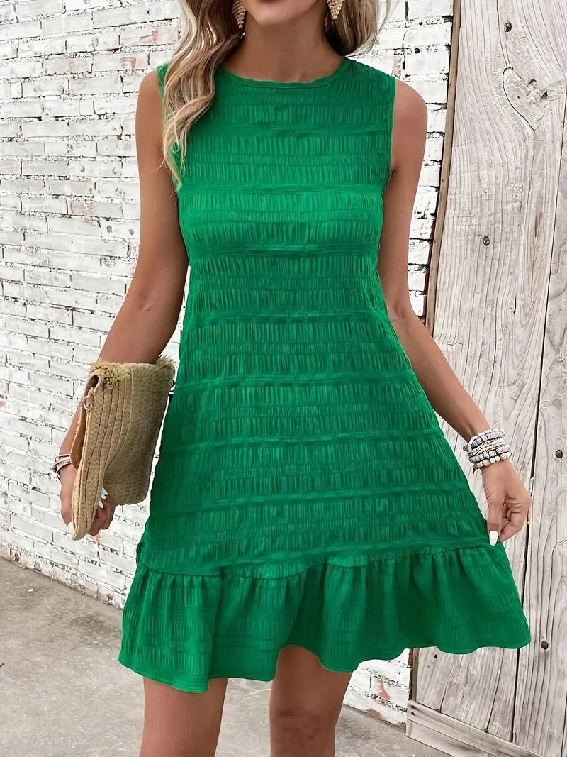 Green sleeveless textured dress with flared hem, perfect for adding texture and movement to your outfit.