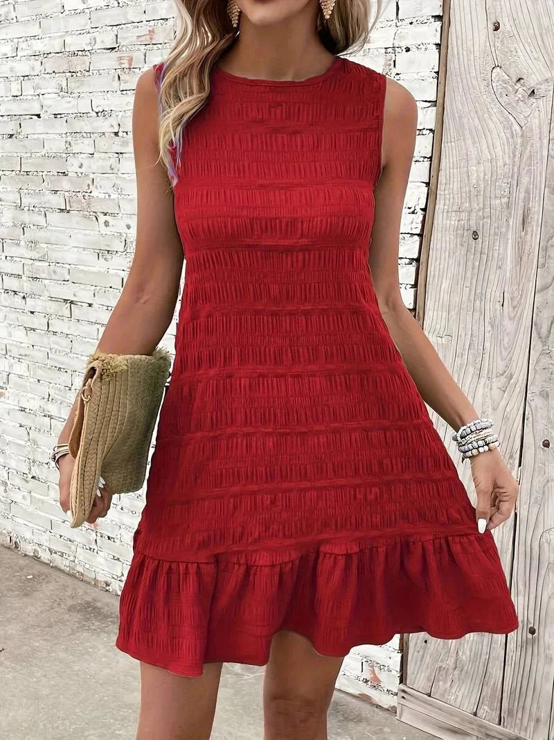 "Red sleeveless textured dress with flared hem made from soft, breathable fabric, perfect for any occasion."