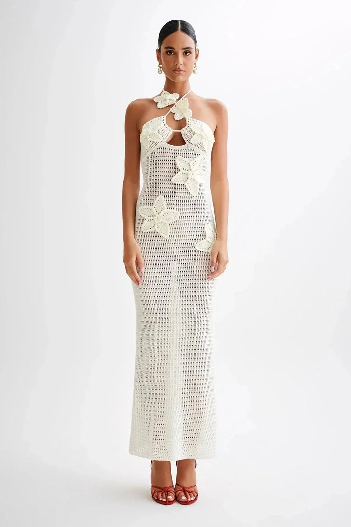 Handmade crochet maxi dress in White with floral design, showcasing intricate detailing and elegant craftsmanship.