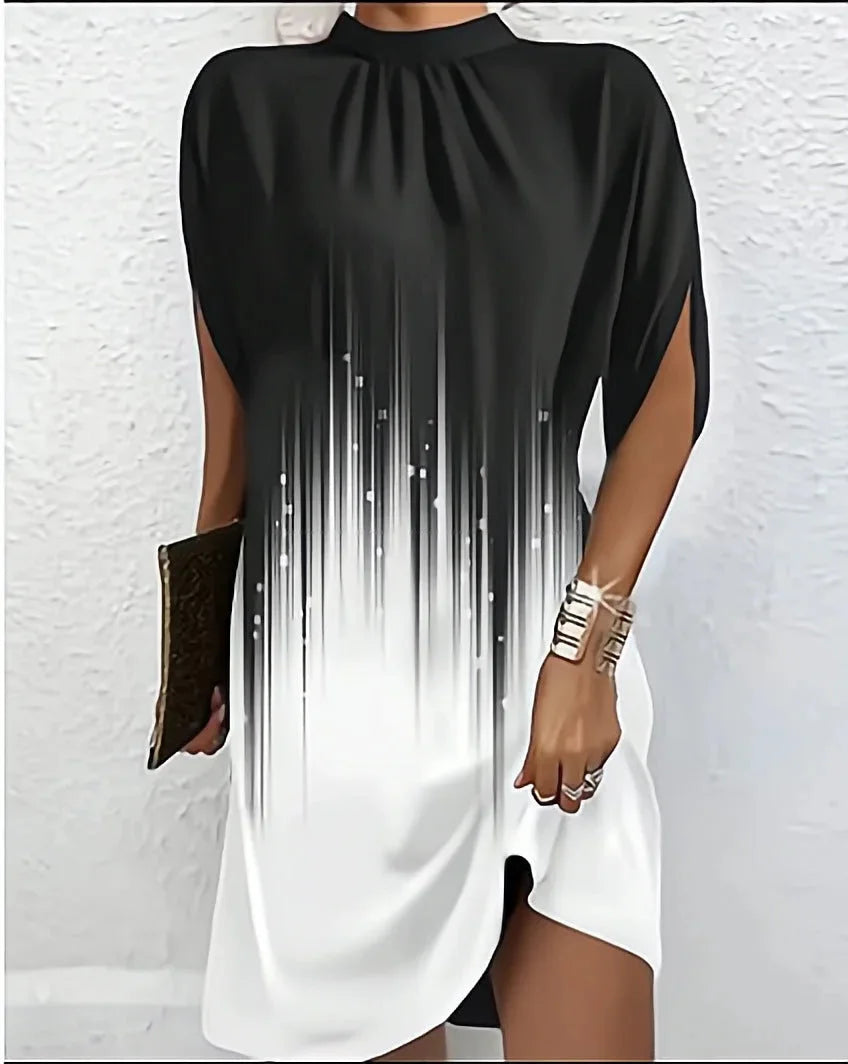 Black and white mini dress with batwing sleeves and pleated neckline, made of high-quality fabric.