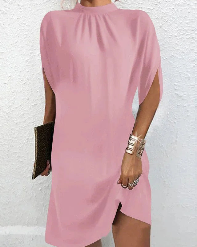 Pink batwing sleeve mini dress with pleated neckline, perfect for casual outings or date nights. Made with comfortable and…