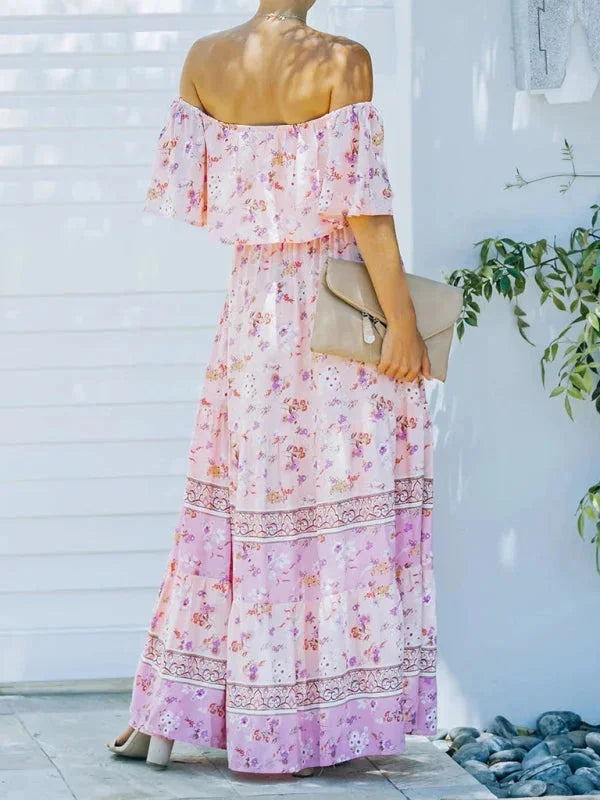 Floral tiered maxi dress in navy with waist belt, perfect for summer.