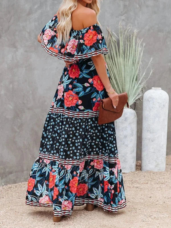 "Floral tiered maxi dress with belt, featuring a lightweight flowy fabric and a charming floral pattern in soft hues."