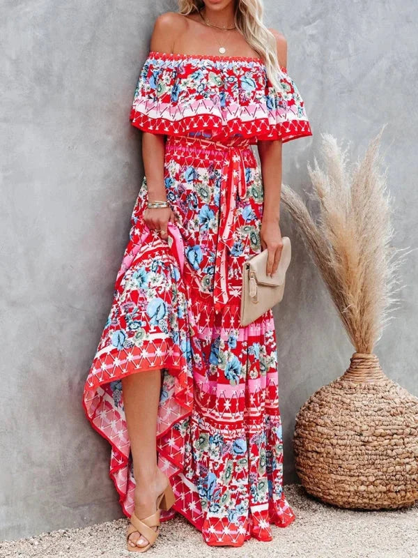 Floral tiered maxi dress with belt in flowing chiffon fabric, featuring a vibrant print and flattering tiered design.