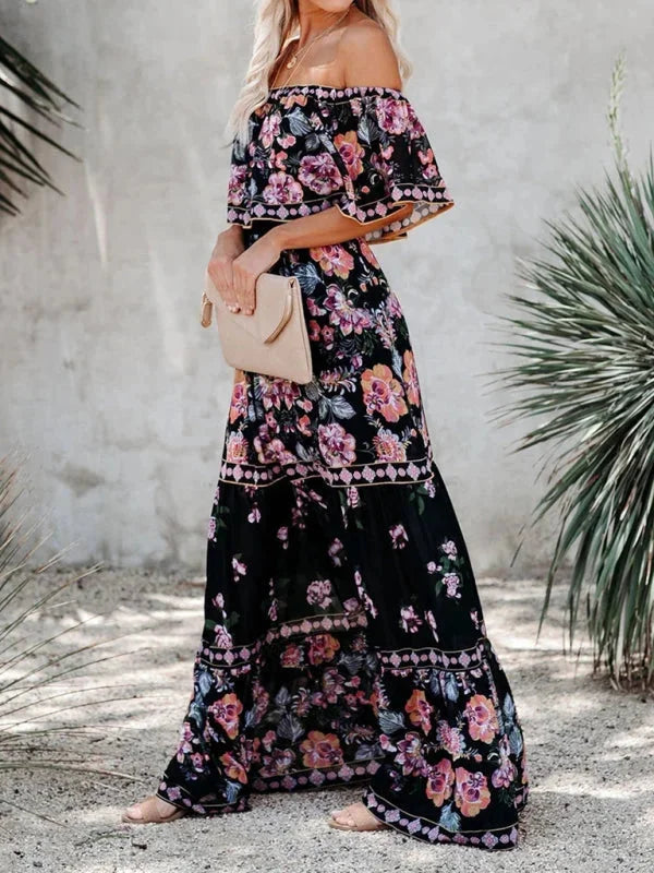 "Emiko maxi dress with floral print, tiered design, and belt detail in lightweight fabric."