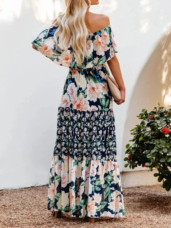 Colorful floral tiered maxi dress with belt, perfect for summer picnics. Made of lightweight, breathable fabric with a…