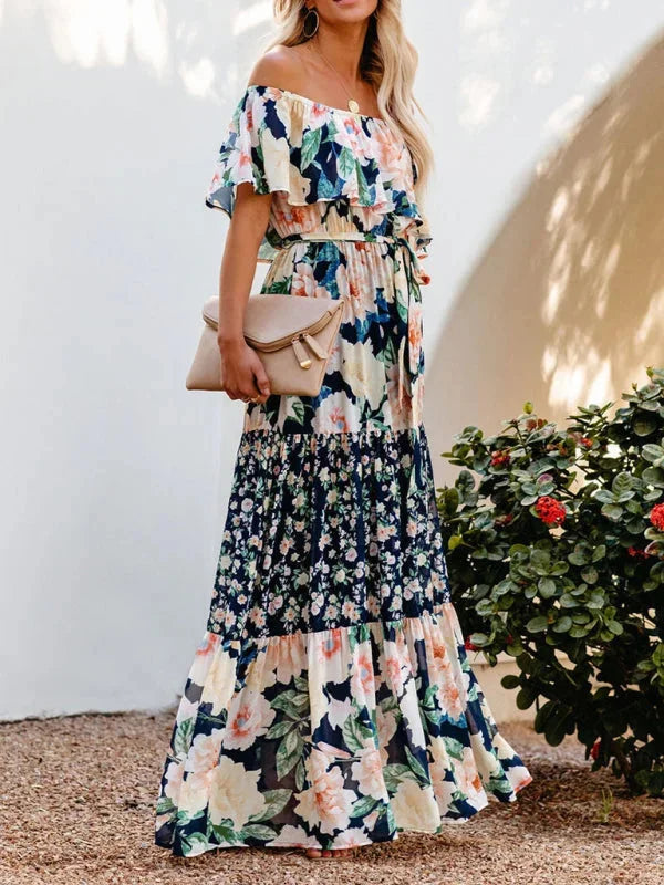 "Emiko - Tiered maxi dress with belt featuring elegant floral print, flowing design, and summery lightweight fabric."