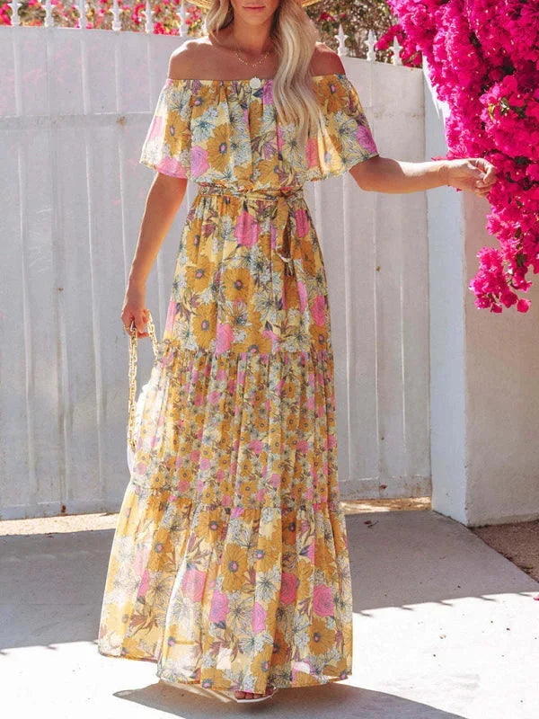 Yellow floral tiered maxi dress with belt made from lightweight flowy fabric. Perfect for a relaxed summer day or casual…