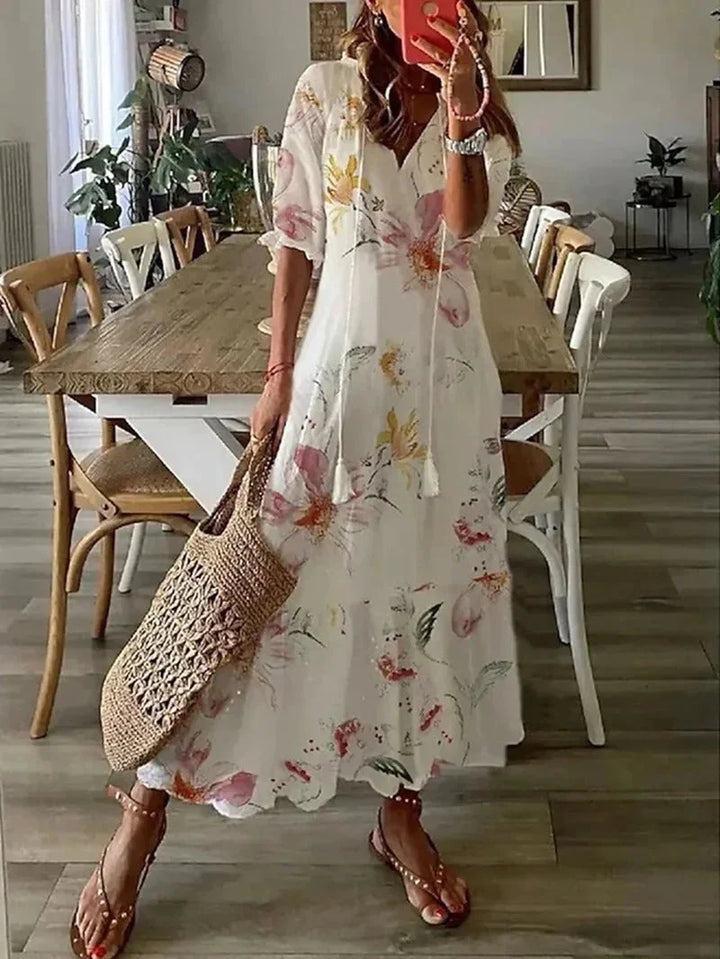 "Emily - Elbow sleeve floral maxi dress in soft, flowy fabric with beautiful floral print."