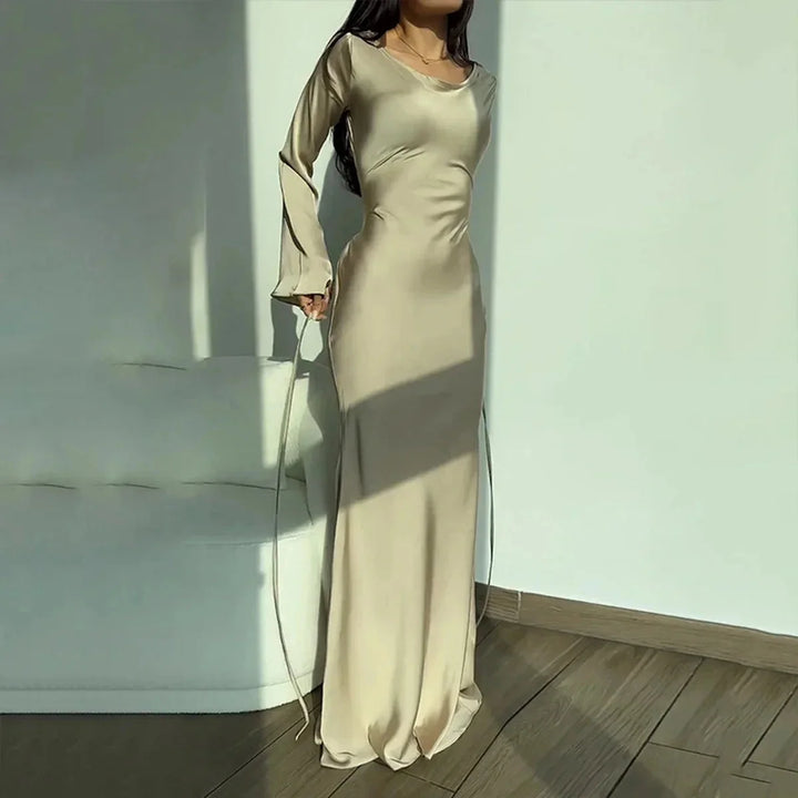 Satin maxi dress in Apricot hue, perfect for evening wear. Features an elegant and timeless design, ideal for special…