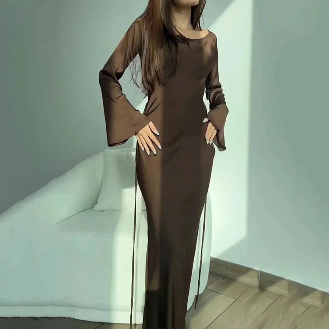 Brown satin maxi dress with elegant design for evening wear. Features a sleek silhouette and flowy fabric for a…