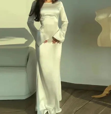 White satin maxi dress with elegant and timeless design for evening wear.