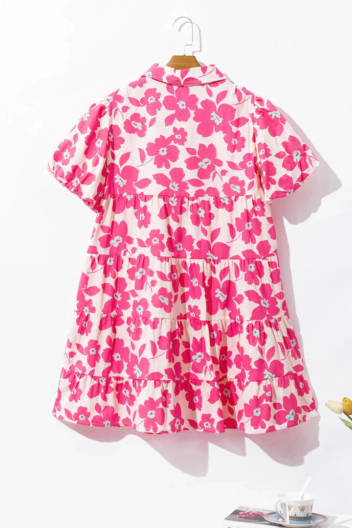 Pink tiered mini dress with floral pattern made of lightweight chiffon. Perfect for a casual day out or a summer event.