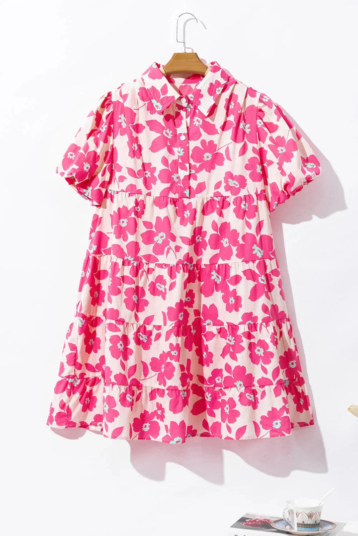 Pink tiered mini dress with a delicate floral pattern, perfect for summers.