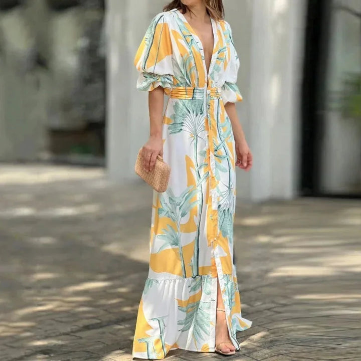 "Tropical-patterned V-neck maxi dress with sleeves ideal for summer outings, made with lightweight breathable fabric."