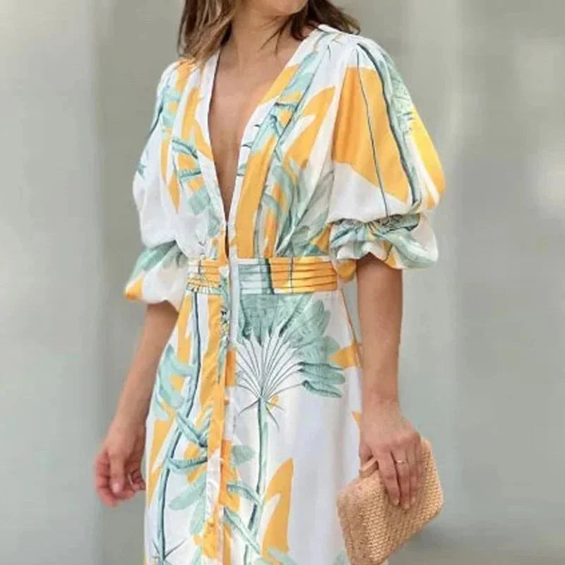 Tropical print maxi dress with V-neck and sleeves, made from lightweight breathable fabric for comfort and style on hot…