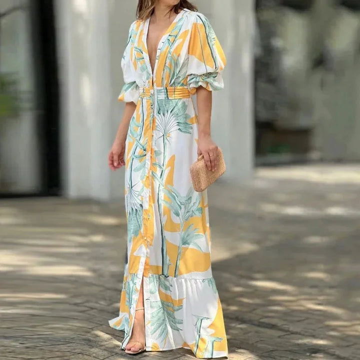 Tropical print maxi dress in green with V-neck and sleeves, made from lightweight, breathable fabric perfect for summer…