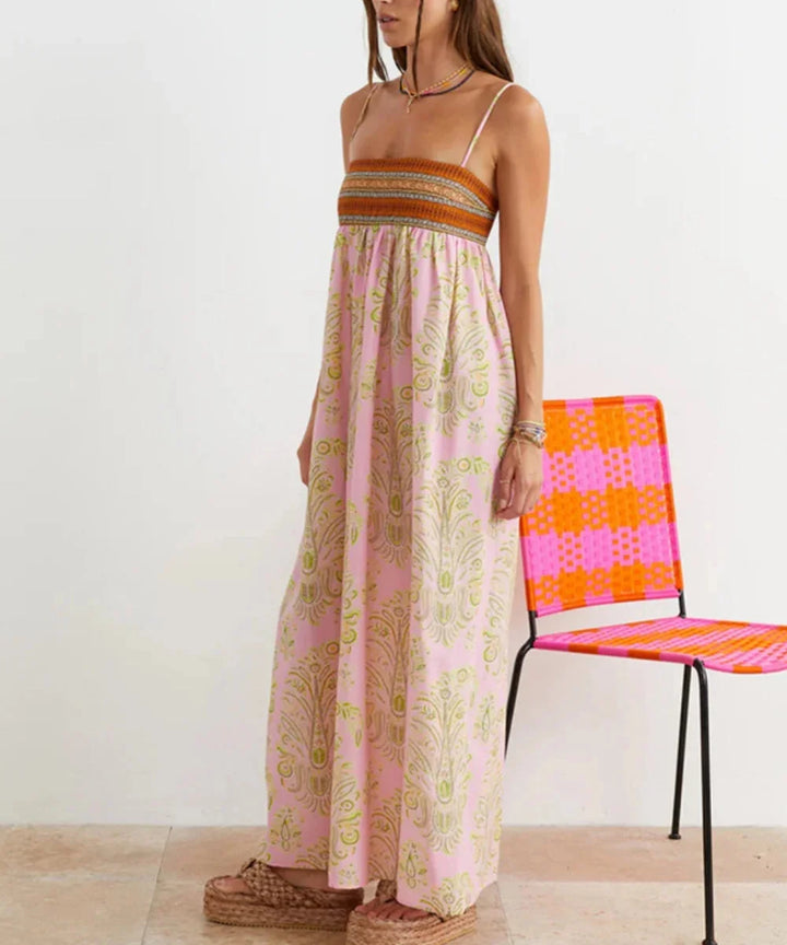 Strapless pink maxi dress featuring bohemian style with intricate detailing, made of soft flowing fabric for a chic and…