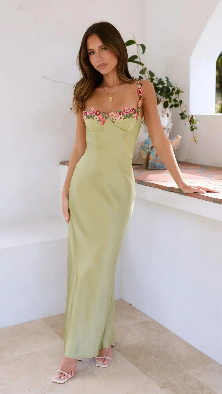 Sage maxi dress with embroidered pink florals, featuring soft and breathable fabric with intricate floral detailing.