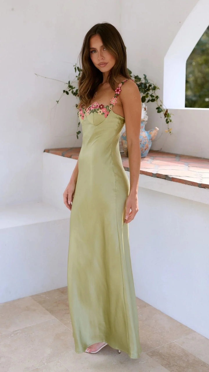 Sage maxi dress adorned with embroidered pink florals, a graceful ensemble perfect for special occasions.