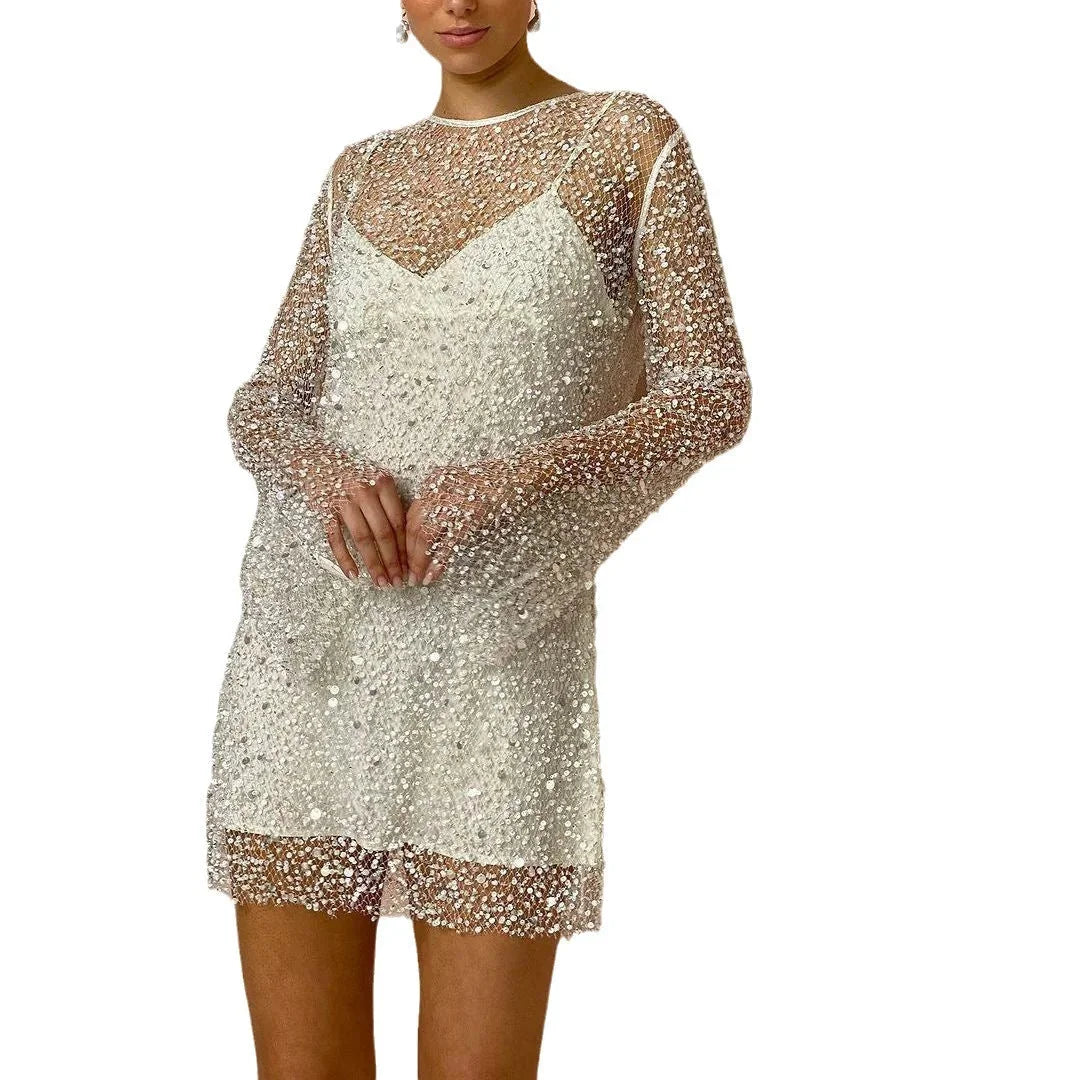 White long sleeve sequined party dress with round neckline and A-line silhouette, perfect for a glamorous night out.