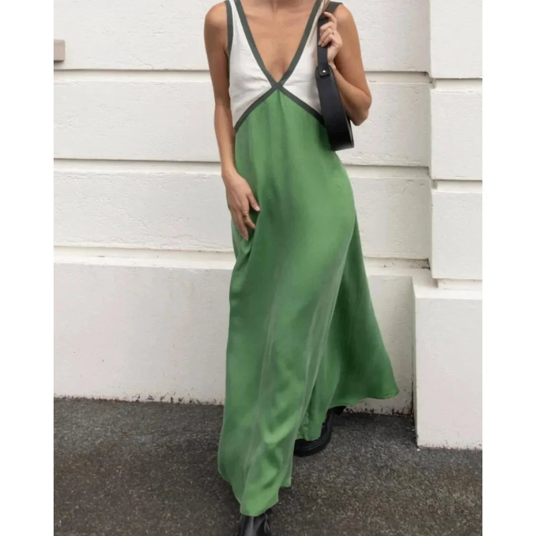 Green satin maxi dress with V-neck design. Flowy and elegant for a chic look.