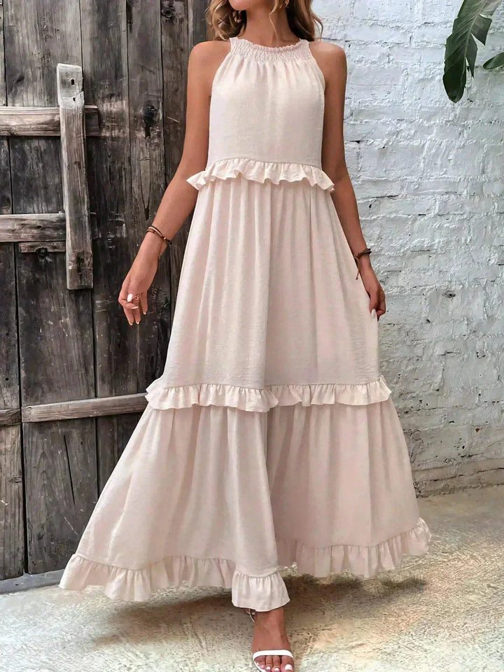 "Greyson Sleeveless Tiered Maxi Dress in a soft, flowing fabric with a tiered design for a boho-chic summer look"