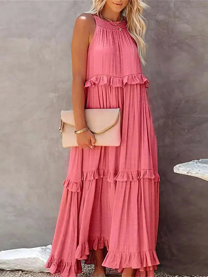 "Sleeveless tiered maxi dress in soft flowing fabric, with tiered design for a relaxed, boho-chic look in shades of soft…