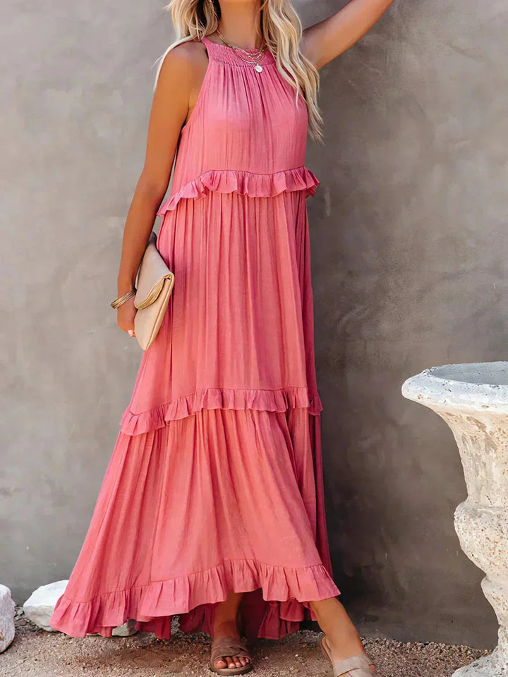 "Sleeveless tiered maxi dress in Grayson, featuring a flowy silhouette perfect for a casual day out or special occasion."