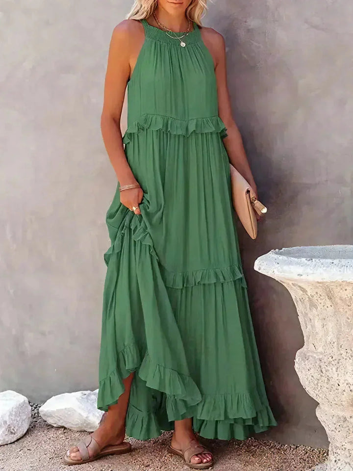 Green sleeveless tiered maxi dress by Greyson. Made of soft cotton blend with a flowy design, perfect for spring and summer…