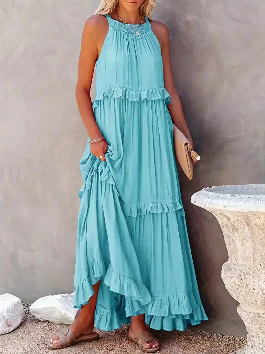 Light blue sleeveless tiered maxi dress made from airy cotton blend. Features a relaxed fit with delicate lace detailing.