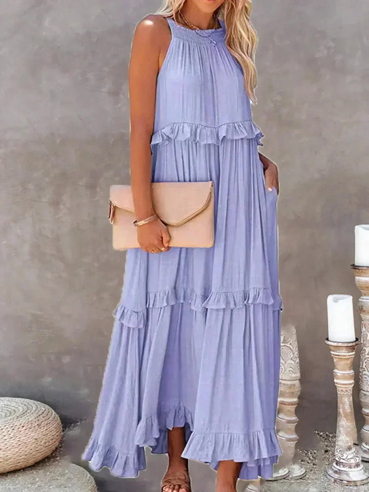 "Lila sleeveless tiered maxi dress in Greyson, made from flowy fabric with delicate ruffle details. Perfect for a chic…