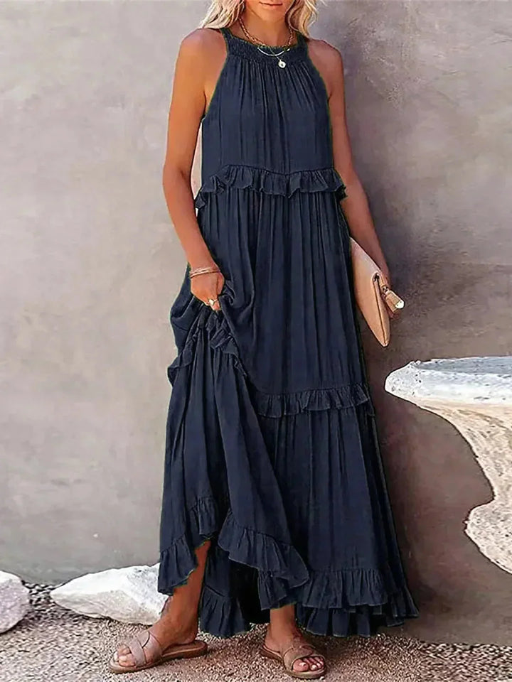 Sleeveless tiered maxi dress in Marine blue with a flowy design, perfect for summertime.