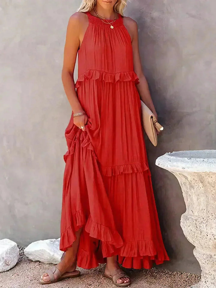 "Red tiered maxi dress without sleeves by Greyson, crafted from lightweight flowing fabric ideal for warm weather."