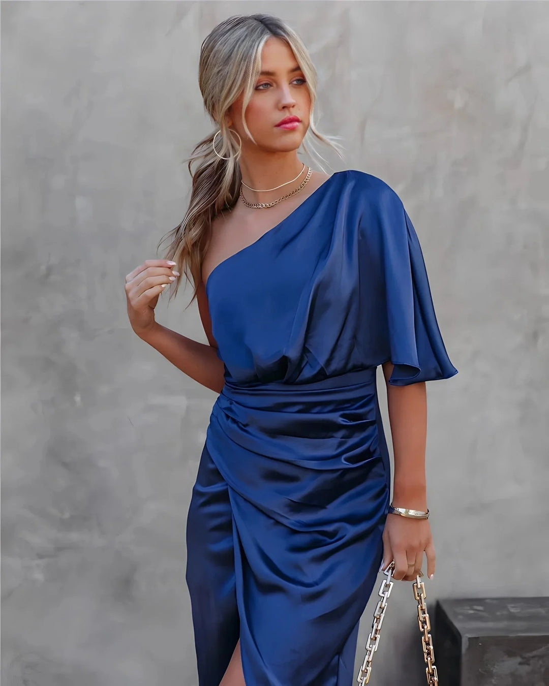 Blue draped midi dress with elegant design perfect for formal events, made of high-quality fabric with flattering silhouette.