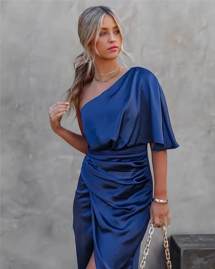 Blue draped midi dress with elegant design perfect for formal events, made of high-quality fabric with flattering silhouette.