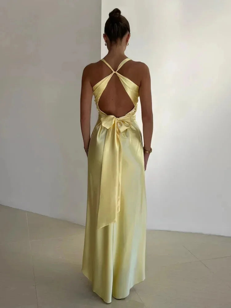 "Pale yellow ruched maxi formal dress in smooth fabric with delicate gathers, perfect for elegant occasions."