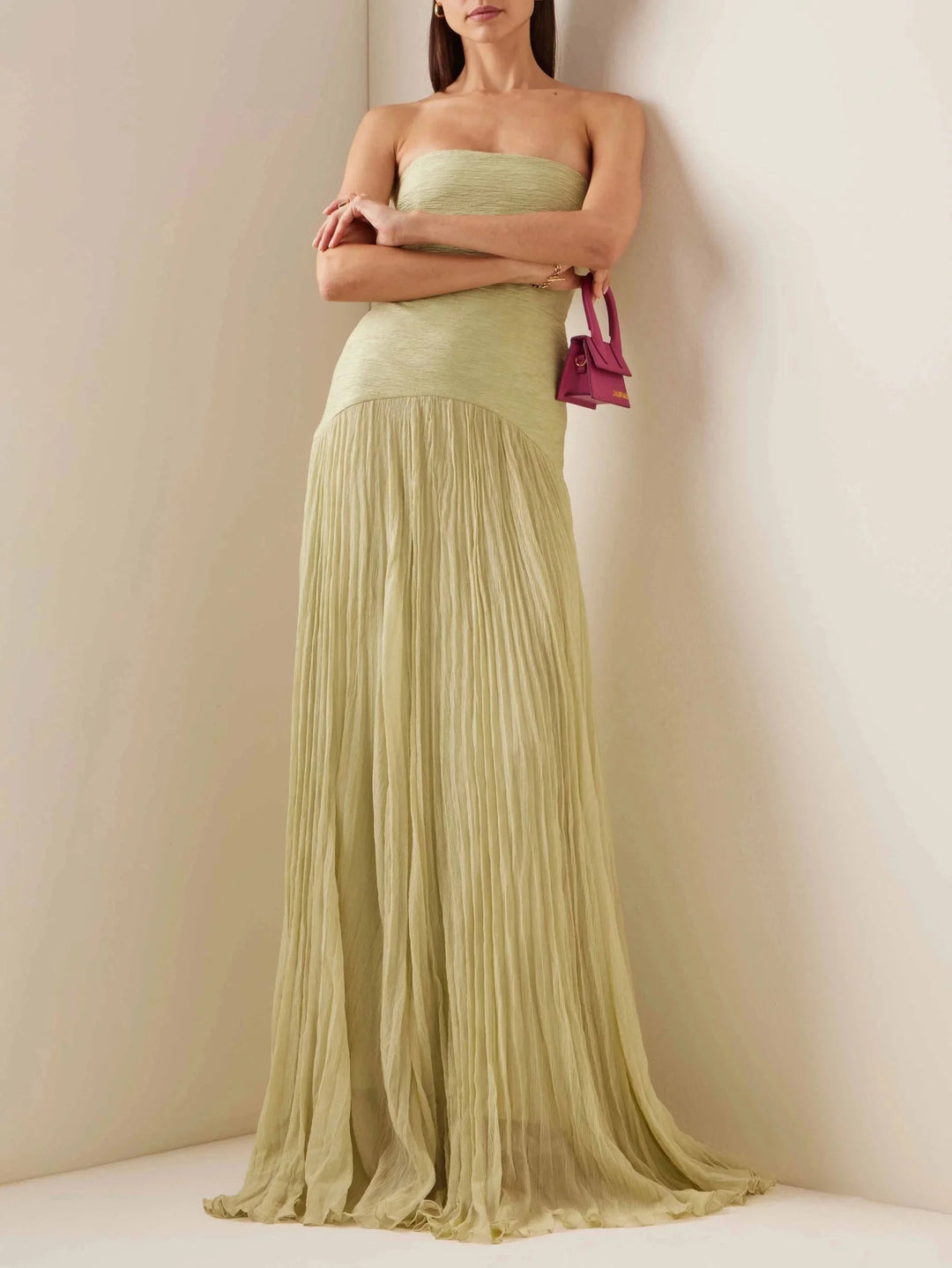 Light green strapless maxi dress with pleated detailing, a classic and elegant look for any formal occasion.