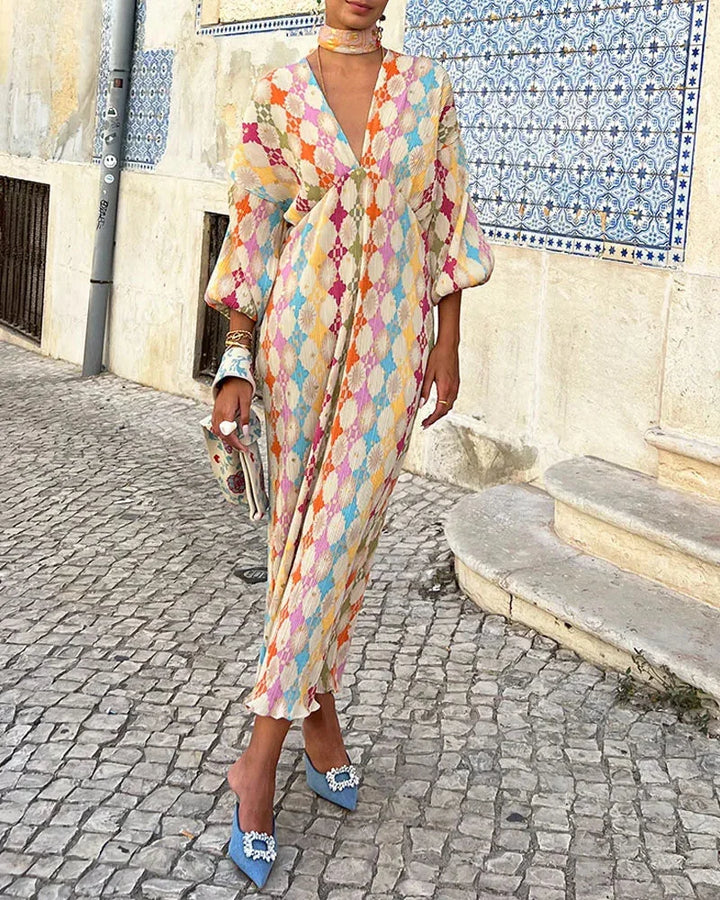 "Isamar wrap dress in Rainbow with pastel geometric pattern, a stylish and versatile addition to your wardrobe."