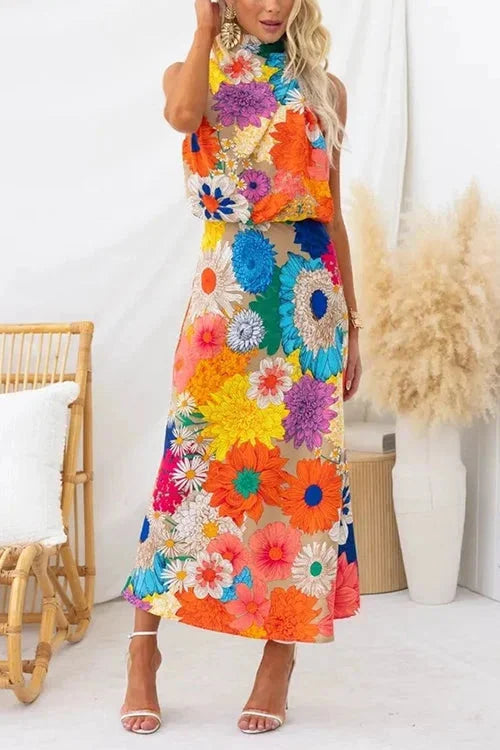 "Floral halter maxi dress in vibrant print, perfect for summer. Features a lightweight and flowy fabric with a flattering…