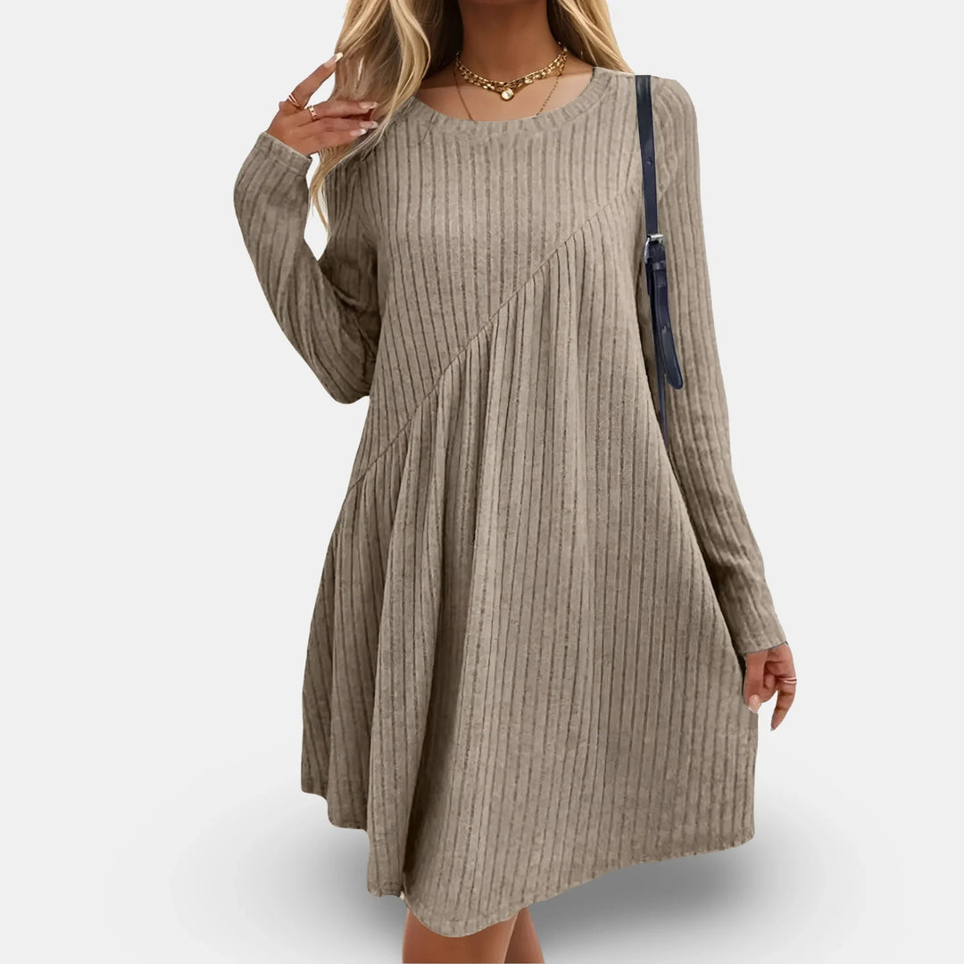 "Black textured swing mini dress featuring long sleeves, perfect for adding sophistication to your wardrobe."