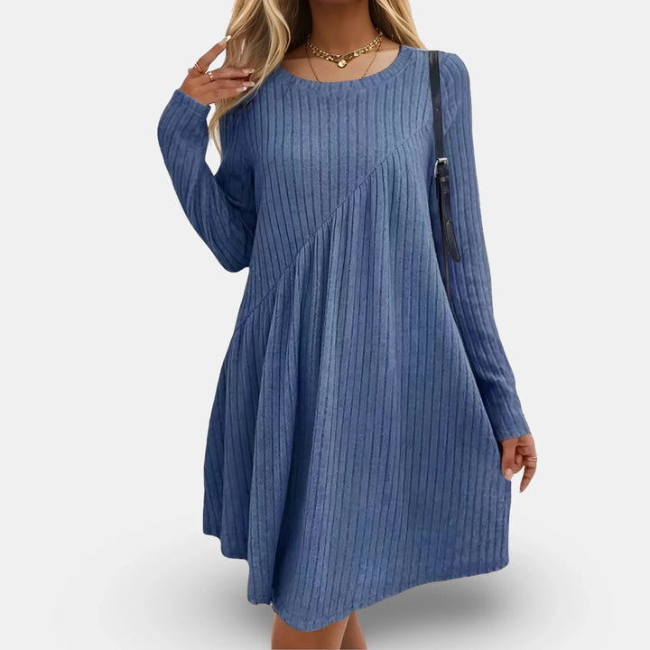 Blue swing mini dress with long sleeves, featuring a textured design.