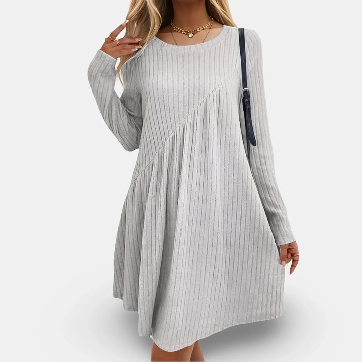 Light grey textured swing mini dress with long sleeves. Made from comfortable and stylish fabric for a chic and effortless…