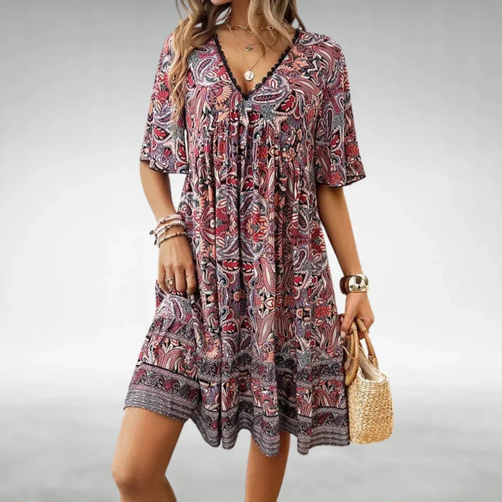 "Red boho mini dress by Jaloni with relaxed fit and intricate detailing, perfect for casual chic looks."