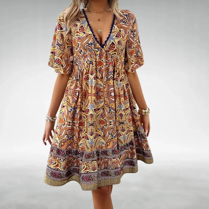 Yellow Jaloni mini dress with a relaxed fit and boho design, made from soft and breathable fabric.