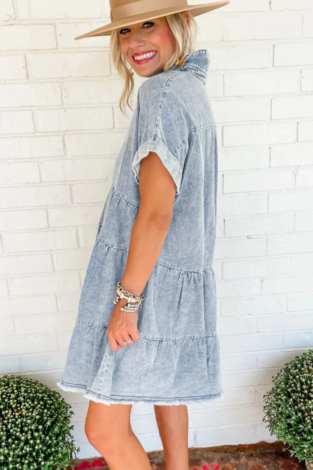 "Denim V-neck dress with acid wash effect, featuring a versatile and trendy design perfect for casual or semi-formal…