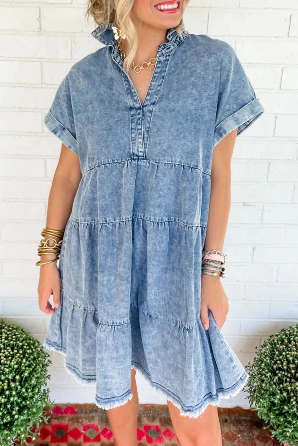 Sky blue acid-wash denim dress featuring a V-neck design. Casual yet stylish, perfect for everyday wear or a day out in town.