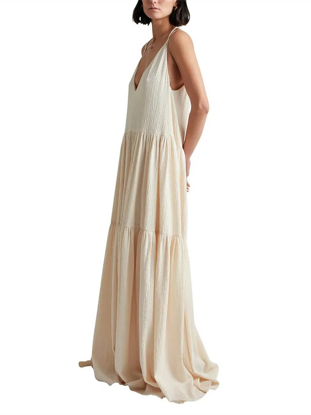 Cream maxi dress with flowing tiered skirt and V-neck design by Jeilani, made of soft and lightweight fabric for effortless…