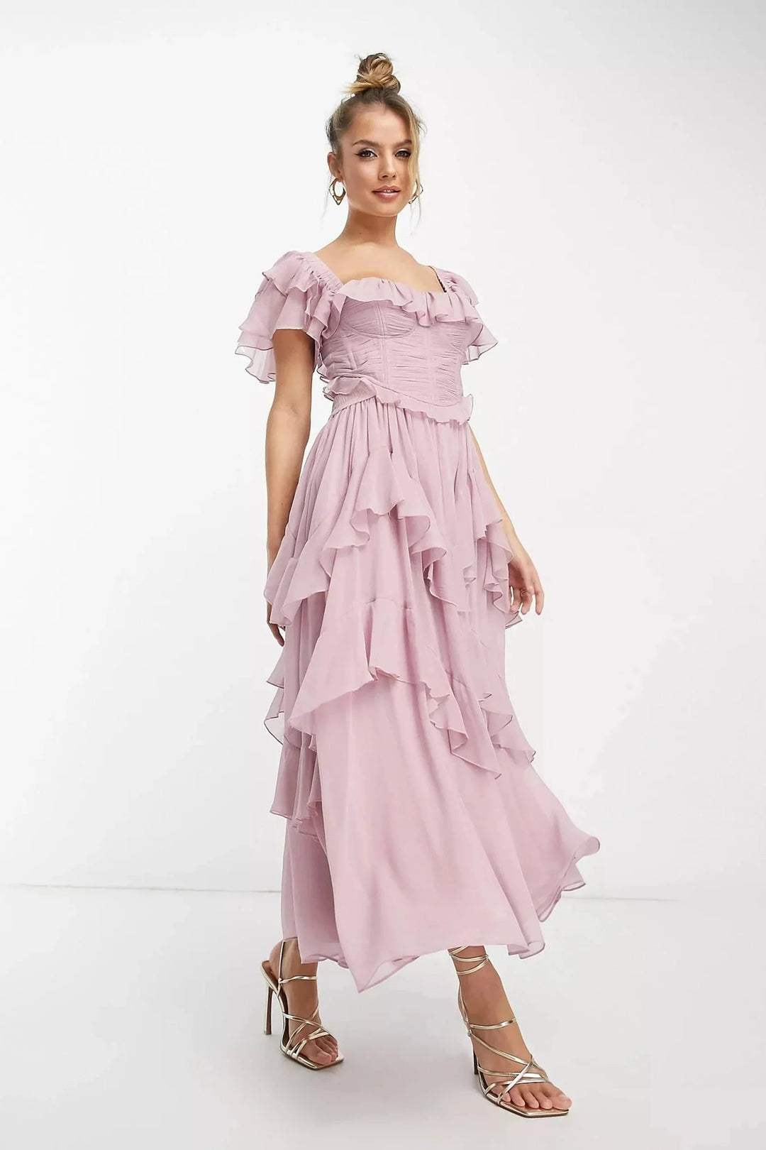 Pink ruffled puff-sleeve maxi dress made of flowy fabric. Ideal for a feminine, stylish look this season.